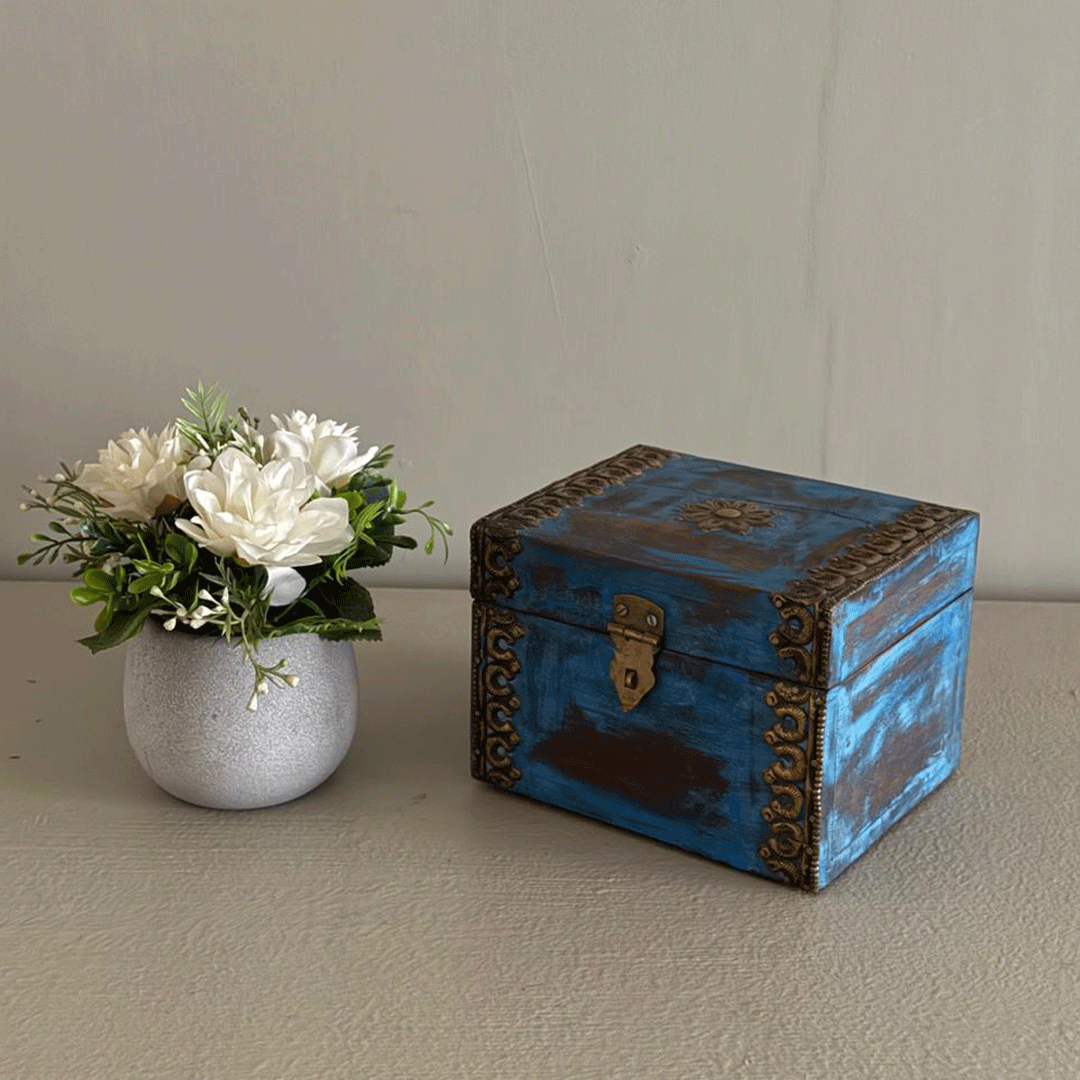 Elegant distressed blue trinket box with brass hand work Elegant distressed blue trinket box with brass hand work